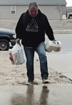 Man slips on ice and drops groceries