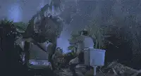 T-Rex pooping on man in toilet