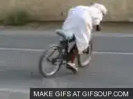 Person in white suit riding a bicycle