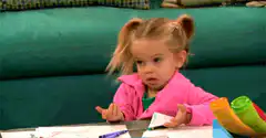 little girl shrugging with confused face