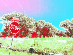 Stop sign in a cemetery with glitch effect