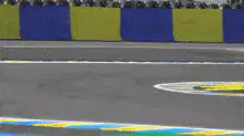 Blue race car spins out on track