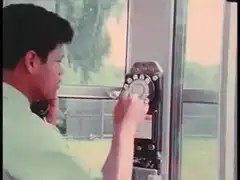 Man dialing rotary phone