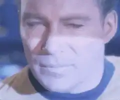 Kirk, Spock, and Uhura wincing