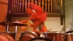 Elmo playing drums