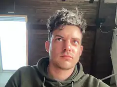man looking up with messy hair