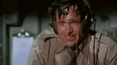 Man sweating and wiping face