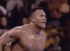 The Rock shrugs in the ring