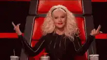 Gwen Stefani shrugs in The Voice chair
