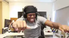 Man in headphones screaming excitedly
