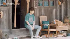Man sitting on porch with sleeping dog