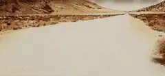 tumbleweed rolling down desert road