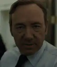 Kevin Spacey nodding and turning away