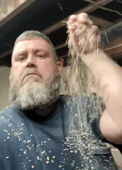 man pouring flour on himself