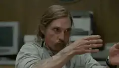 Man miming shooting a gun
