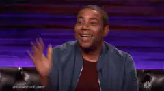 Kenan Thompson waving excitedly