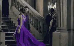 Man in purple mask at formal event