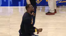 LeBron James falls over with basketballs