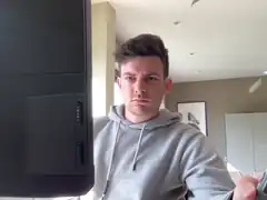 man looking at computer monitor