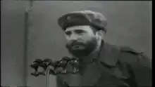 Fidel Castro raises hand