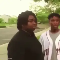 Two guys pointing at each other with GN text