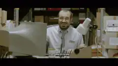 Dwight Schrute laughing at computer