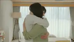 Couple hugging and smiling in bedroom