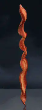 Cooking bacon strip
