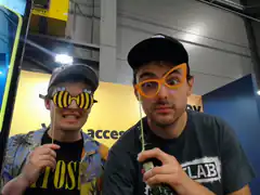 Two men wearing funny glasses at a convention