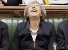 Theresa May laughing hysterically