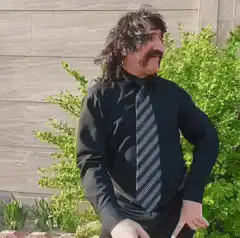 Man in mask dancing outside