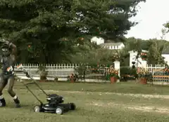 Man dancing with lawnmower