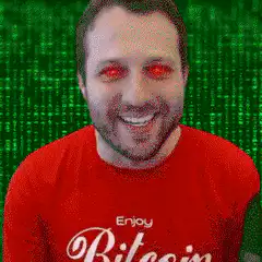 Man with glowing red eyes in Bitcoin shirt