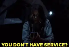 Eleven from Stranger Things looking at phone