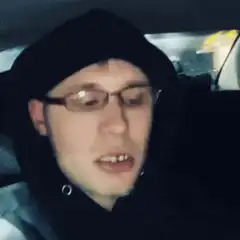 man vaping in car