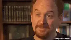Louis C.K. smiling and nodding