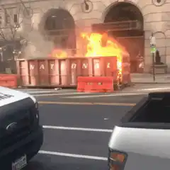 Dumpster fire on city street