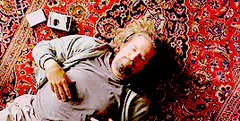 Bill Burr lying on a rug