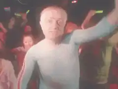 Dancing man in blue mesh shirt