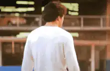Jackie Chan turns and gives a thumbs up