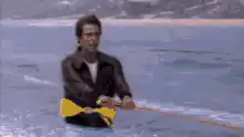 Man on water skis hits ramp and flies