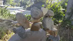 Stacked rocks collapse in the wind