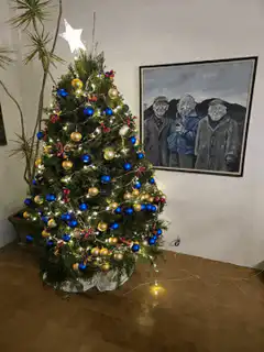 Christmas tree with lights and painting