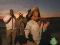 Man in winter hat dancing outdoors