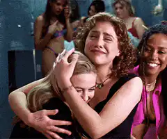Girls crying and hugging in locker room