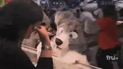 Woman crying over husky plush