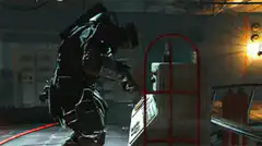 Soldier in dark armor inspecting a crate