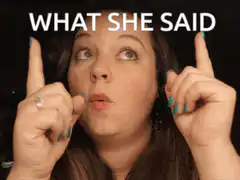 Woman pointing up with text What She Said