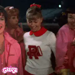 Rizzo from Grease smiling