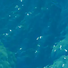 Blue water surface with light reflections